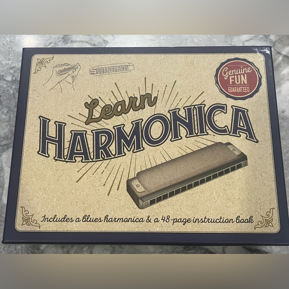 Learn Harmonica Set with Instruction Book New in Box 
Harmonica in packaging